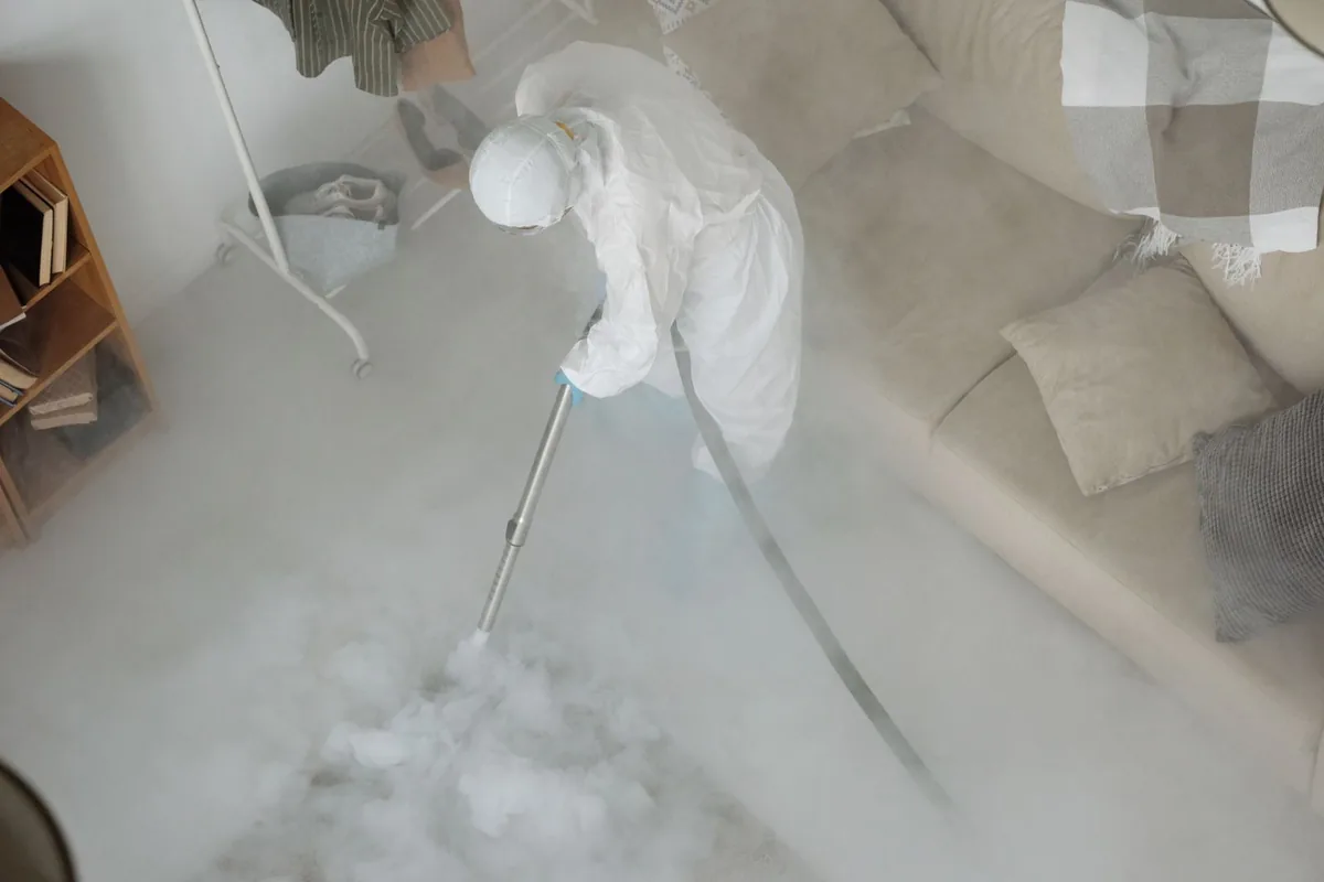 Biohazard cleanup technician in protective equipment, Attalla, AL